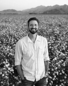 Photograph of Kam Mickolio in Field